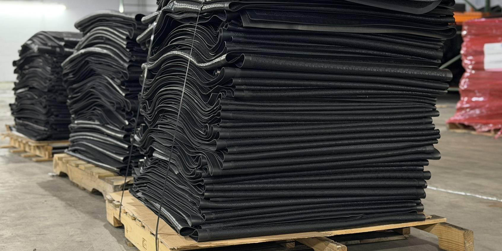 Dense stacks of walk-off mats prepared on pallets